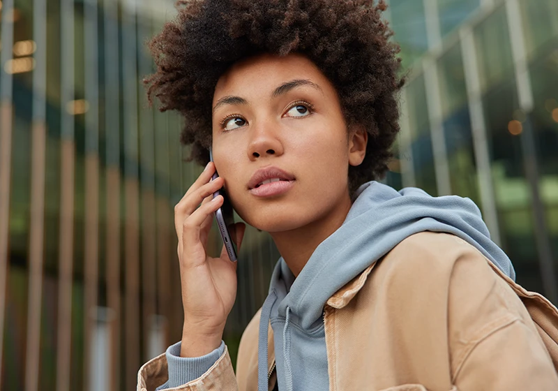 A young woman receiving an emergency alert by phone